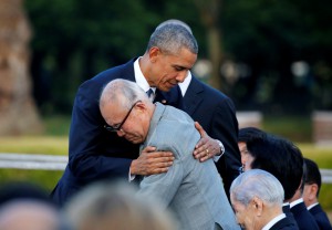 U.S. President Barack Obama hugs  atomic bomb survivor Mori as he visits Hiroshima Peace Memorial Park in Hiroshima, Japan